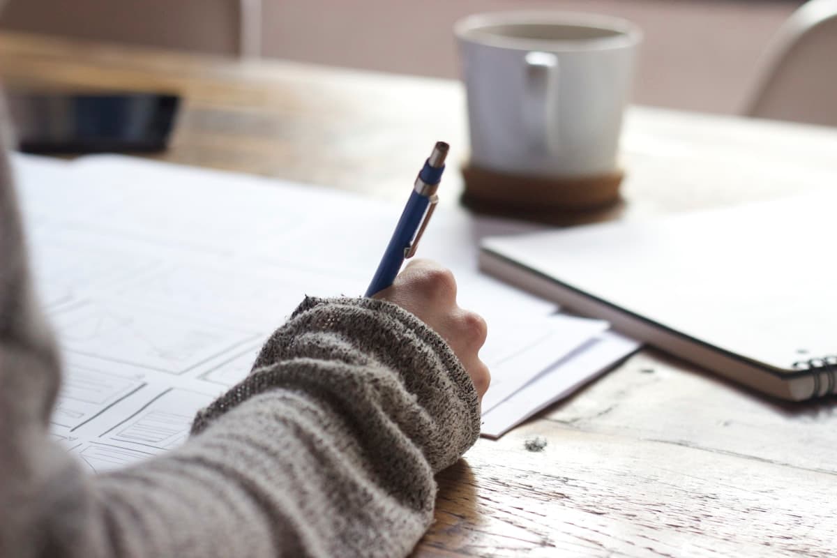Student preparing for TOEFL test day with study materials and checklist